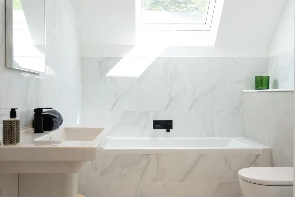a white bathroom with a sink and a toilet at Pityoulish Steading - Seasgair Lodges in Aviemore