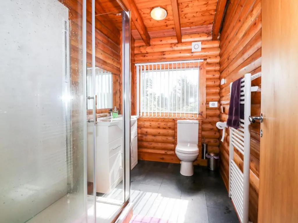 a bathroom with a toilet and a sink at Rocksite in Blairgowrie