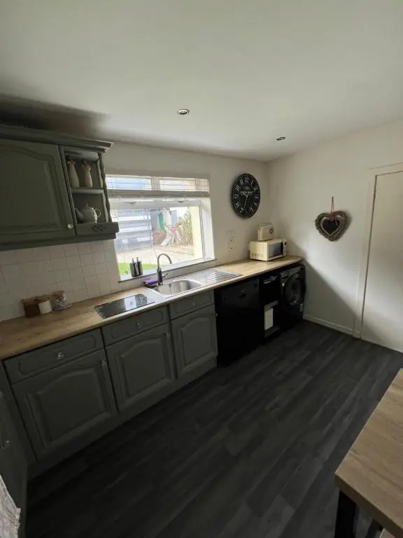 a kitchen with a sink and a dishwasher at MaCaMor in Helmsdale