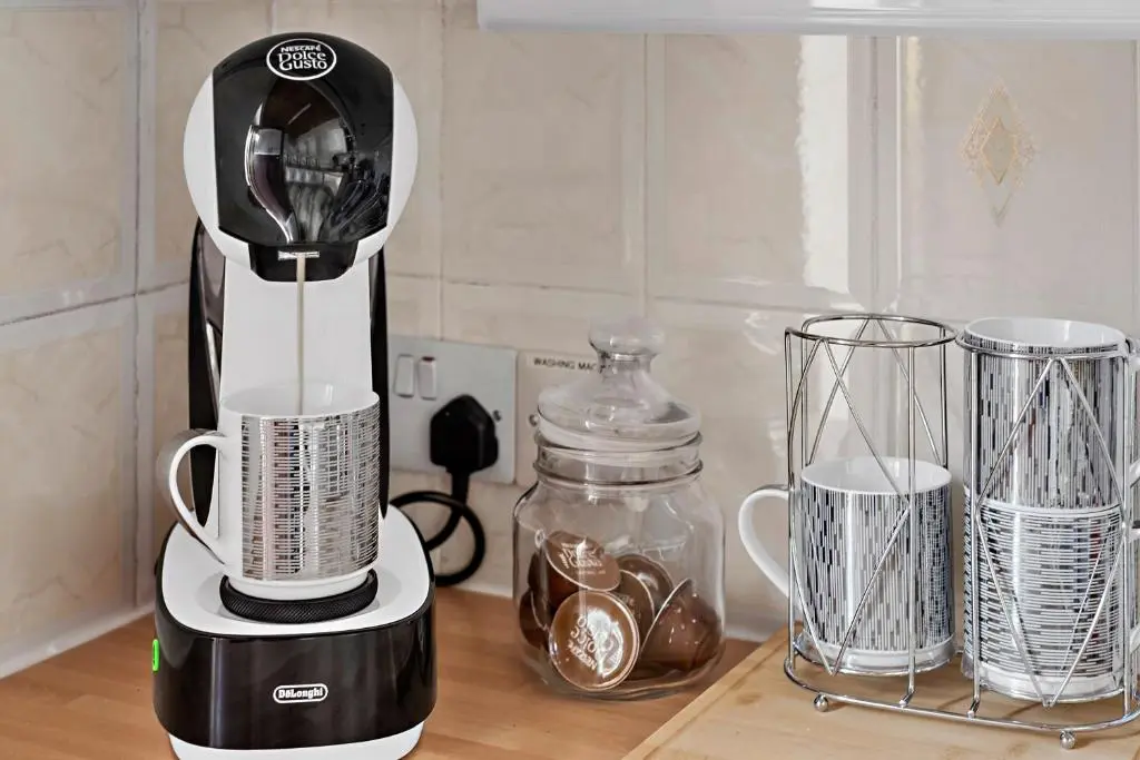 a black and white blender sitting on top of a counter at Finest Retreats - The Sea Cottage in Avoch