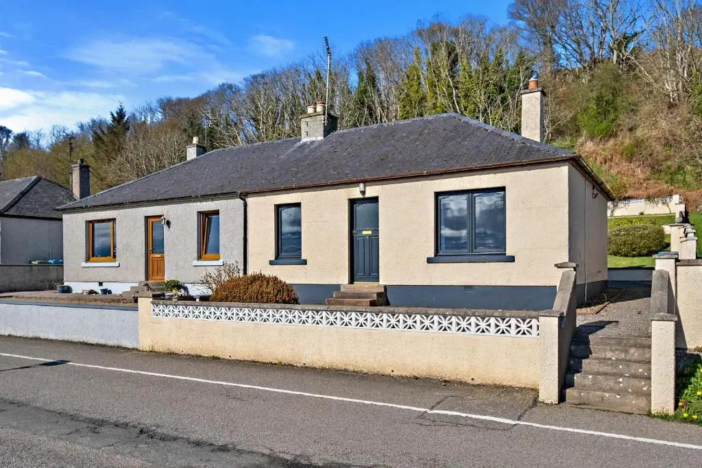 a house on the side of a street at Finest Retreats - The Sea Cottage in Avoch