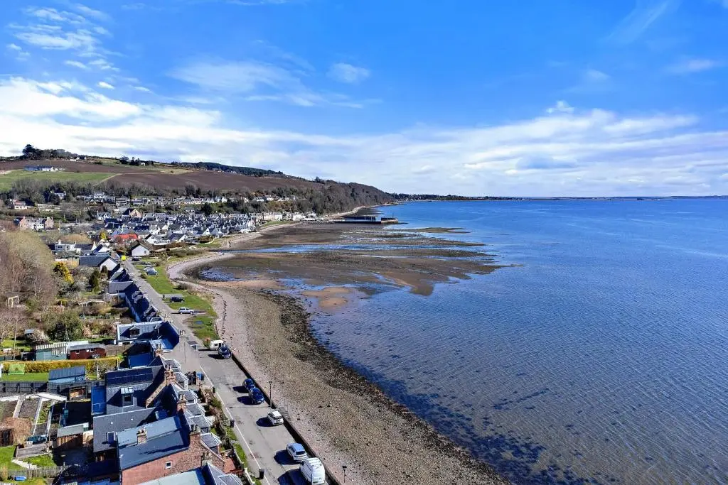 an aerial view of a beach and the water at Finest Retreats - The Sea Cottage in Avoch
