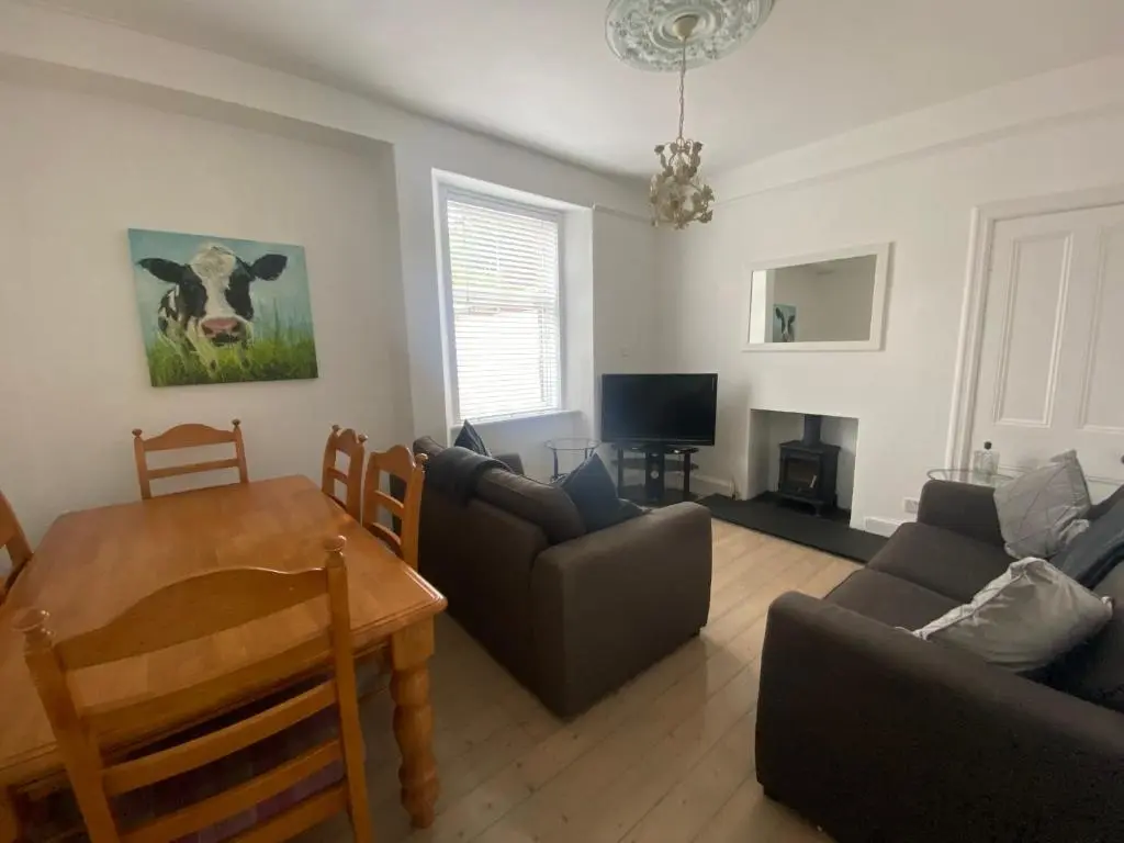 a living room with a couch and a table at Stanford House in Inverness