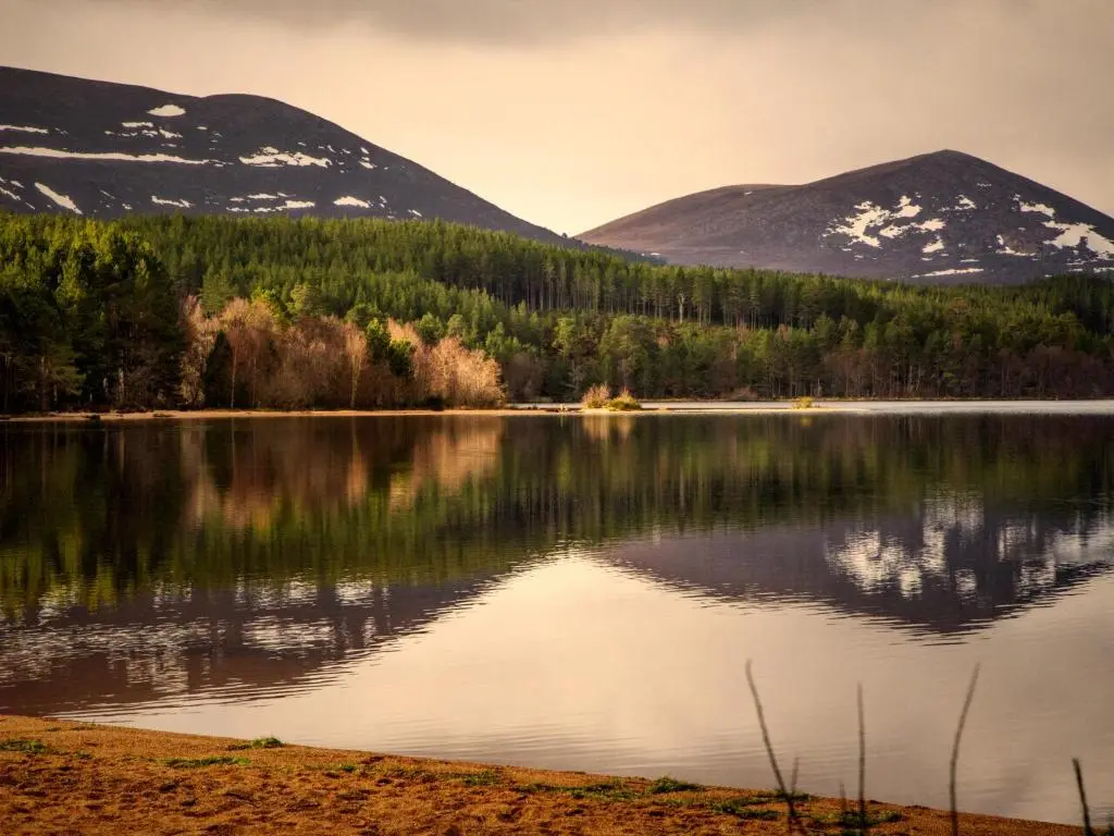 a view of a lake with mountains in the background at Glenrothay in Aviemore