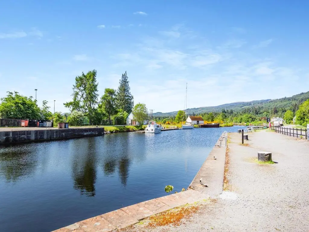 a body of water with a boat in it at Lockview Upper Flat in Fort Augustus