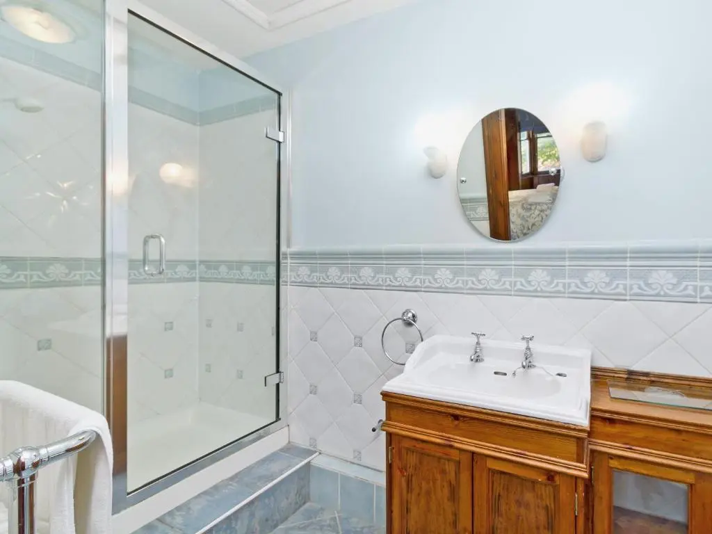 a bathroom with a sink and a shower at Dess Lodge in Kincardine O\u02bcNeil