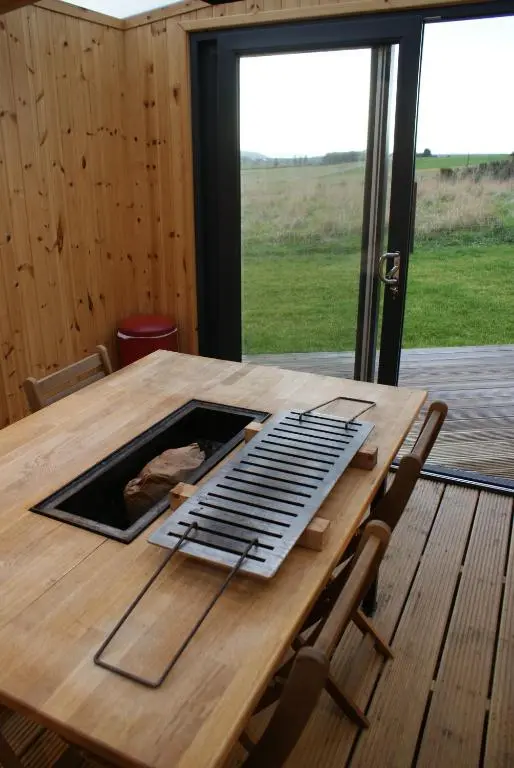 a wooden table with a keyboard on top of it at Meikle Balloch in Keith