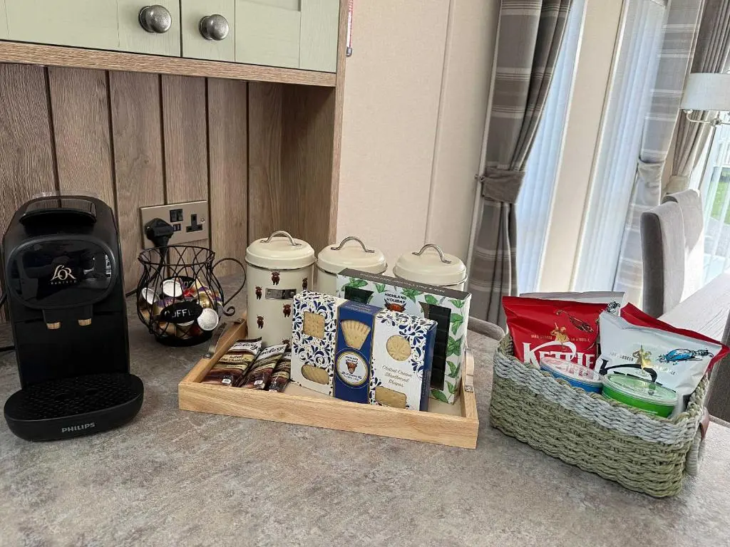 a group of food items on a table in a room at Highland Holiday Getaways - The Heilan' Lodge in Embo