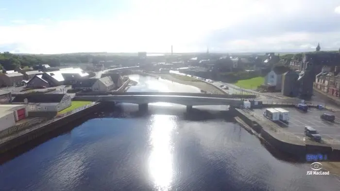 a bridge over a river in a city at Impala Guest House in Wick