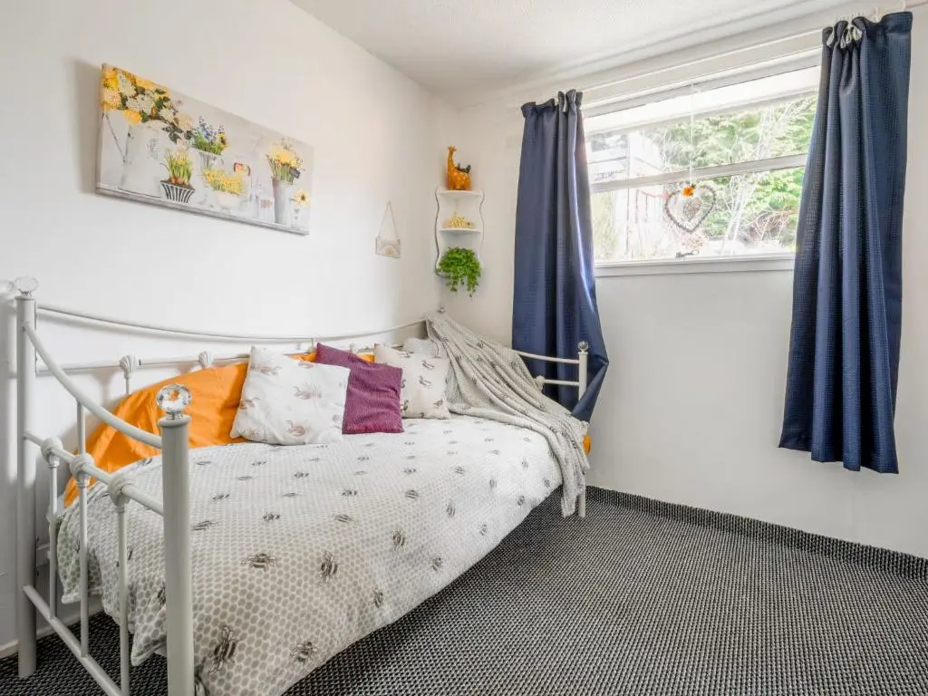 a bedroom with a bed and a window at Holiday Home Lochness by Interhome in Contin