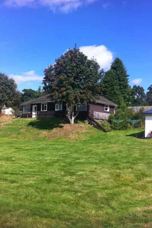 a house with a tree in the middle of a yard at Holiday Home Isle of Skye by Interhome in Contin