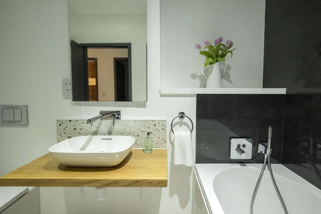 a bathroom with a sink and a bath tub at The Neuk in Kincraig