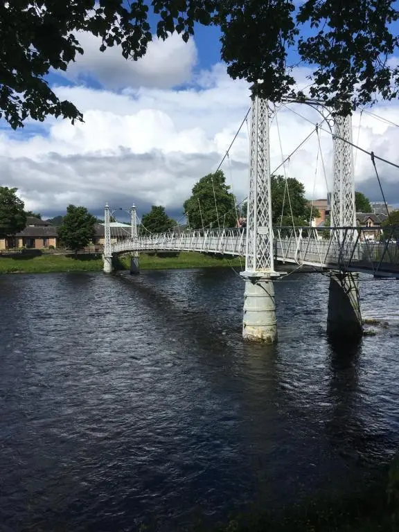a white bridge over a river with water at Room Only Corbies Rest in Inverness