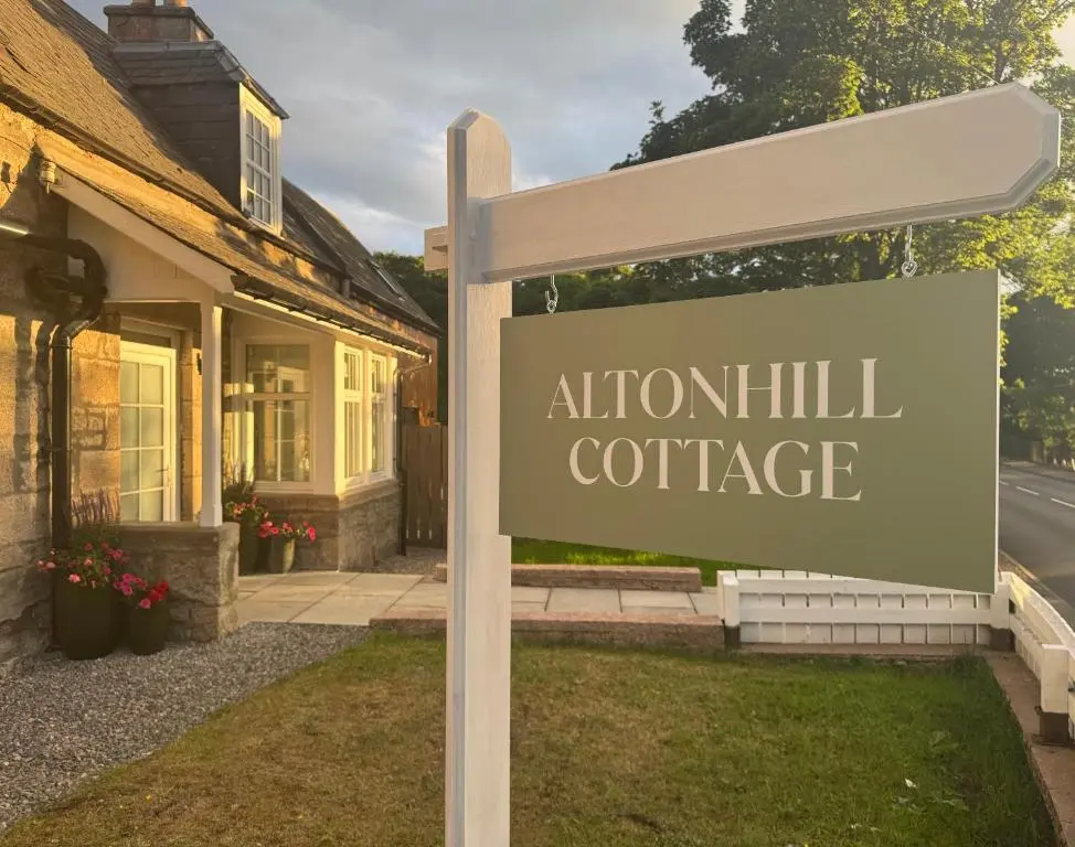 a sign in front of a house at Altonhill Cottage - room only in Nairn