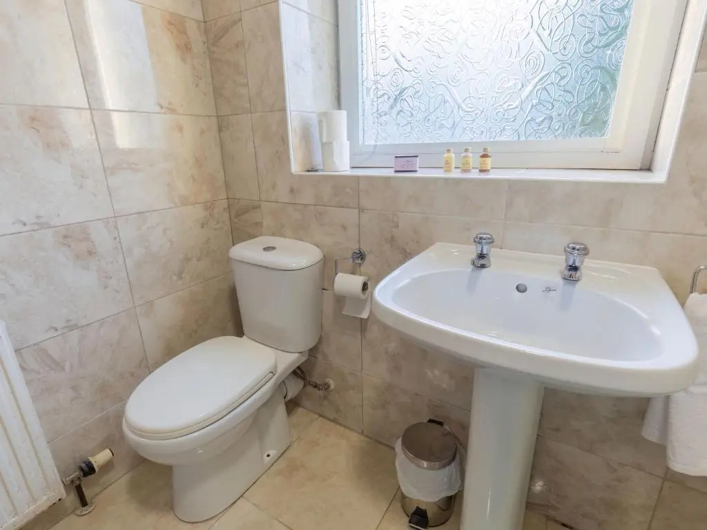 a bathroom with a toilet and a sink at Holiday Home Beech by Interhome in Inverness