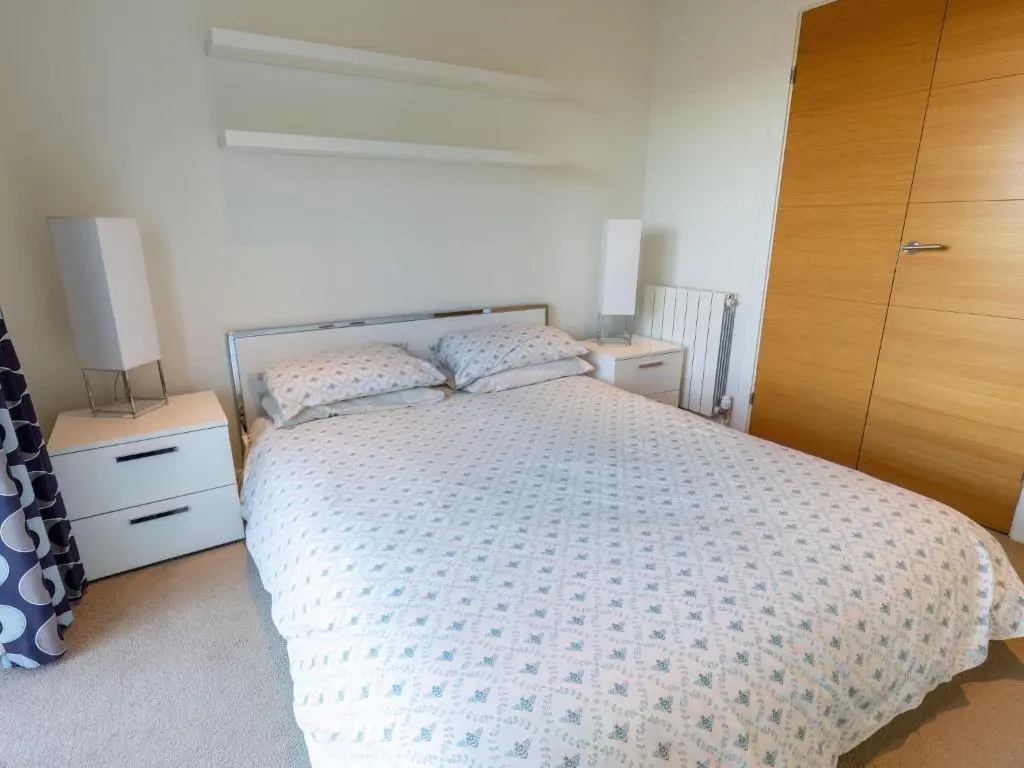 a bedroom with a bed and two night stands at Apartment Druid Temple by Interhome in Inverness