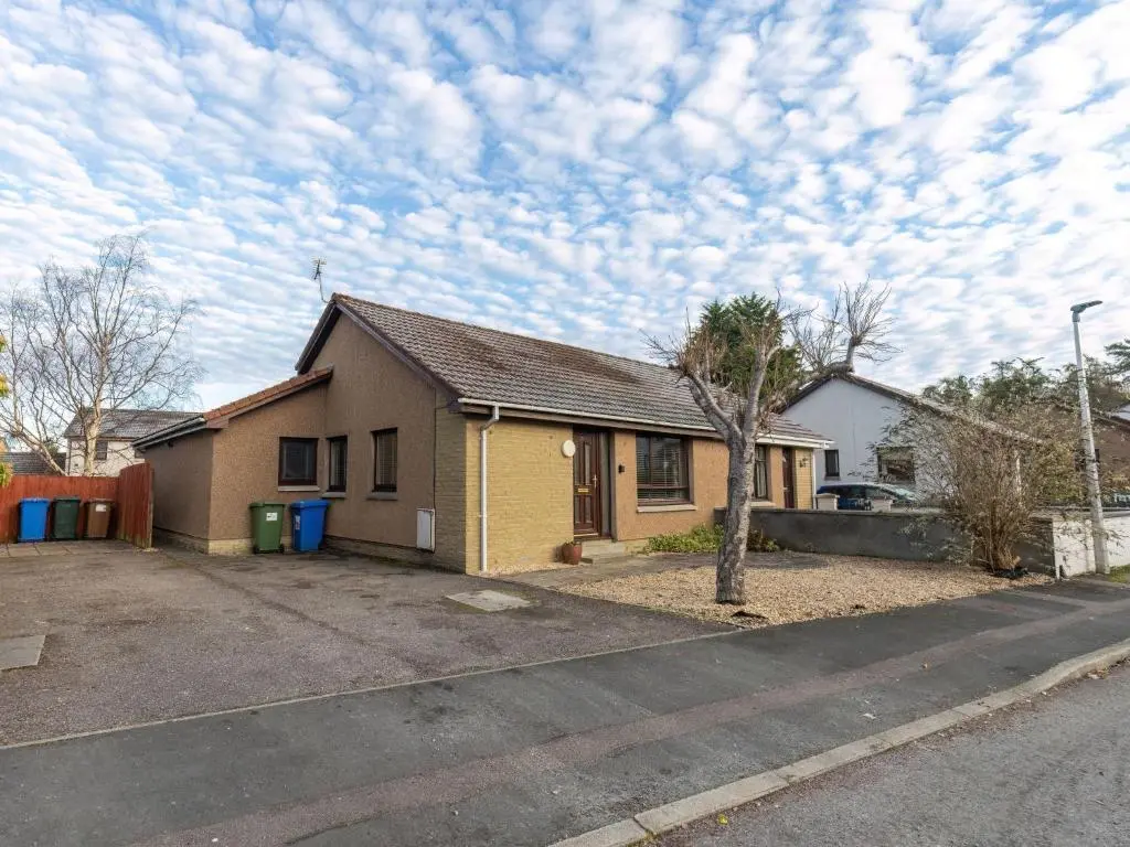 a house on the side of a street at Holiday Home Ardness Place by Interhome in Inverness