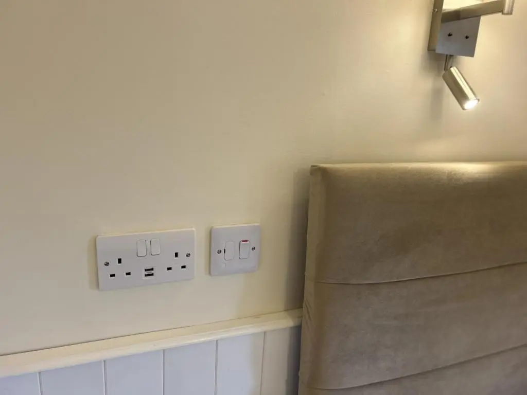 a room with two electrical outlets on the wall at Corunna Bed & Breakfast and Corunna Cottage in Inverness