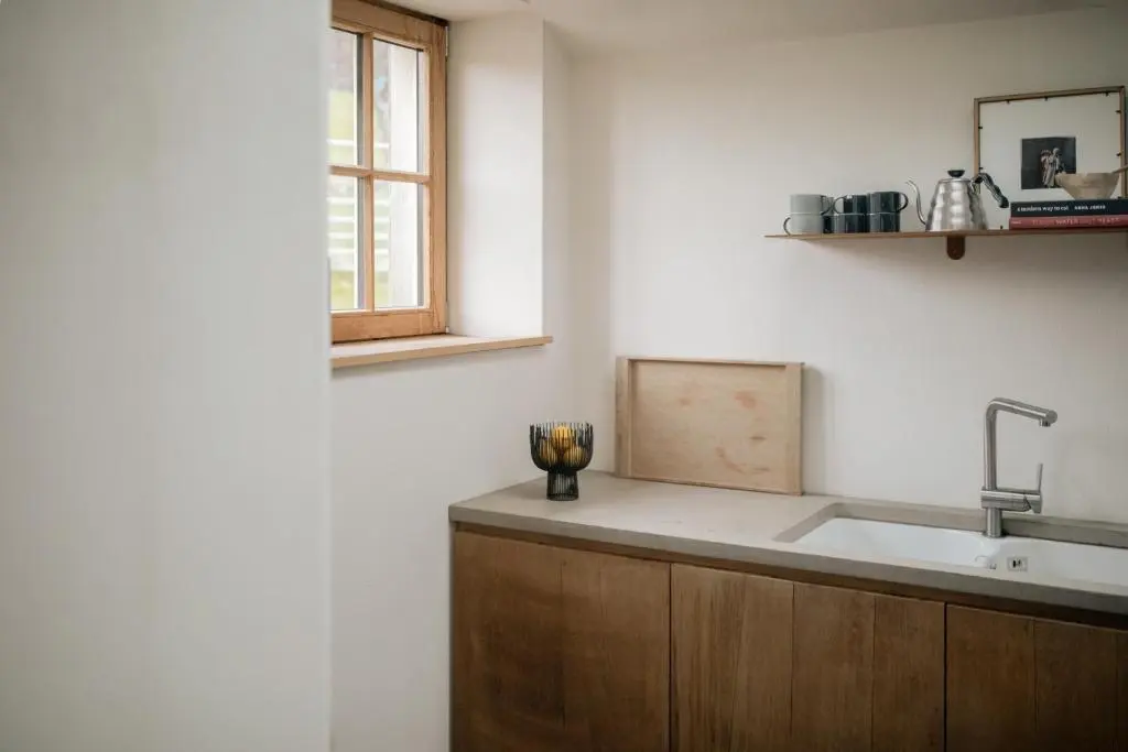 a kitchen with a sink and a window at Inverenzie Cottage, Rooms with a view! in Coilacriech