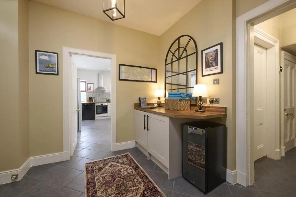 a hallway with a counter in a home at Dunaincroy Farmhouse in Inverness