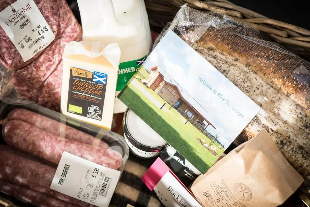 a basket of food with meat and other groceries at Aurae in Nairn