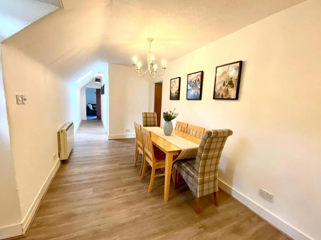 a dining room with a table and chairs at Bruachdryne Braemar Accommodation in Braemar