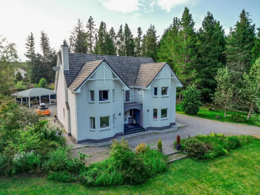 an aerial view of a house with a yard at Cardon House - luxury Highland holiday home in Inverness