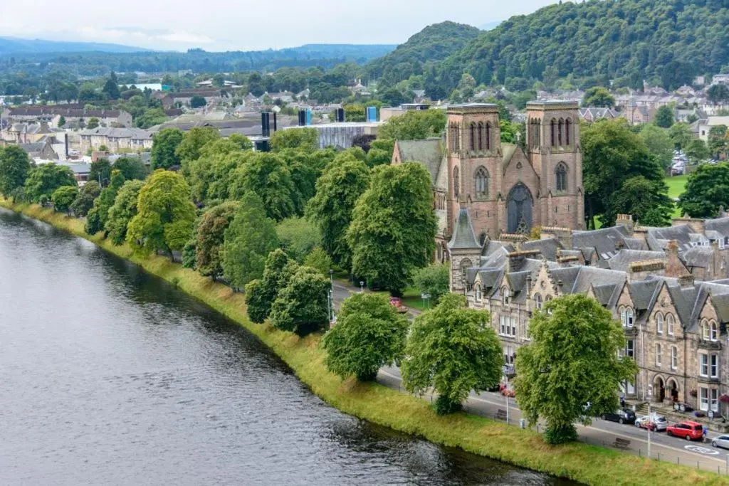 an aerial view of a town next to a river at Cathedral Apartment in Inverness