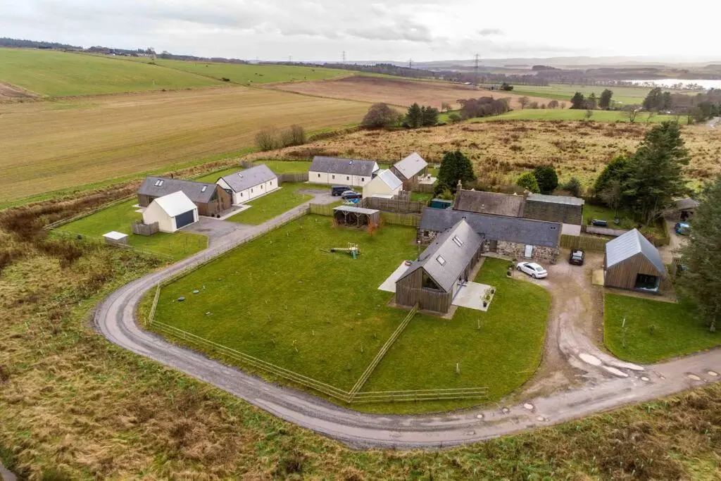 an aerial view of a farm with a road at Architect Designed Lodge in Dunecht
