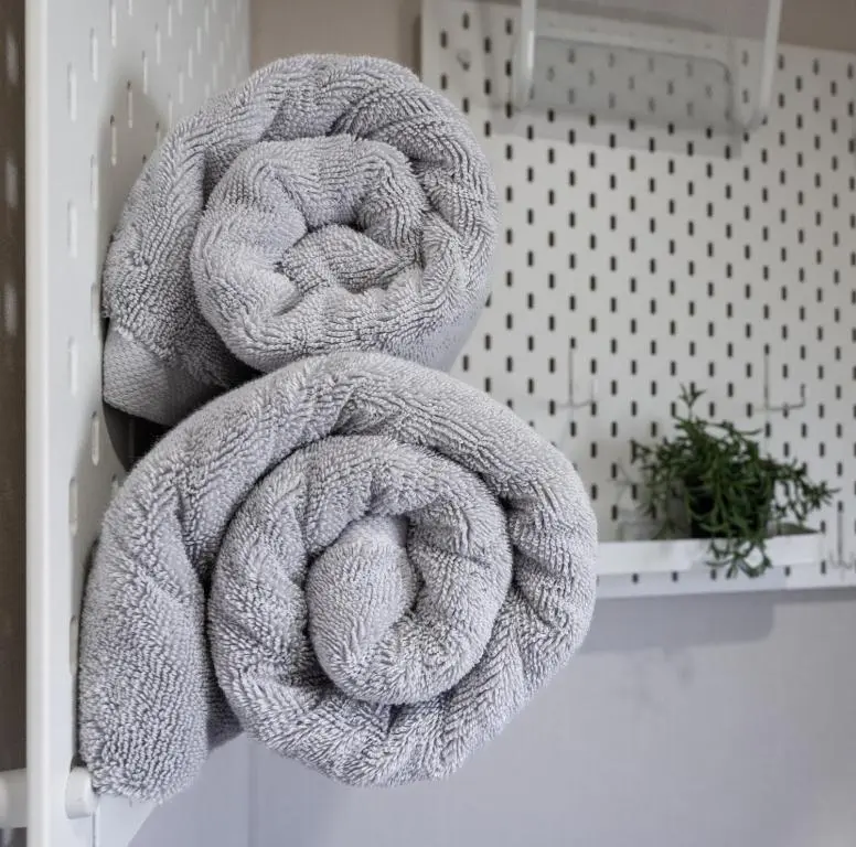 a couple of towels sitting on a wall at Highland Chalet - Peaceful Stay near Dornoch in Dornoch