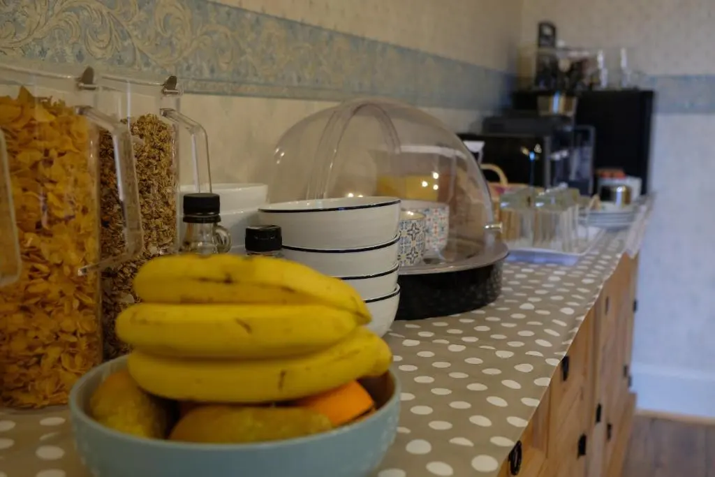 a bowl of bananas and oranges on a kitchen counter at Morlea Bed & Breakfast in Drumnadrochit