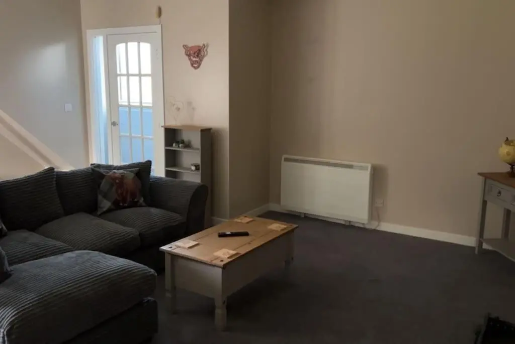 a living room with a couch and a coffee table at GWR Dickson's House, NC500, Wick in Wick