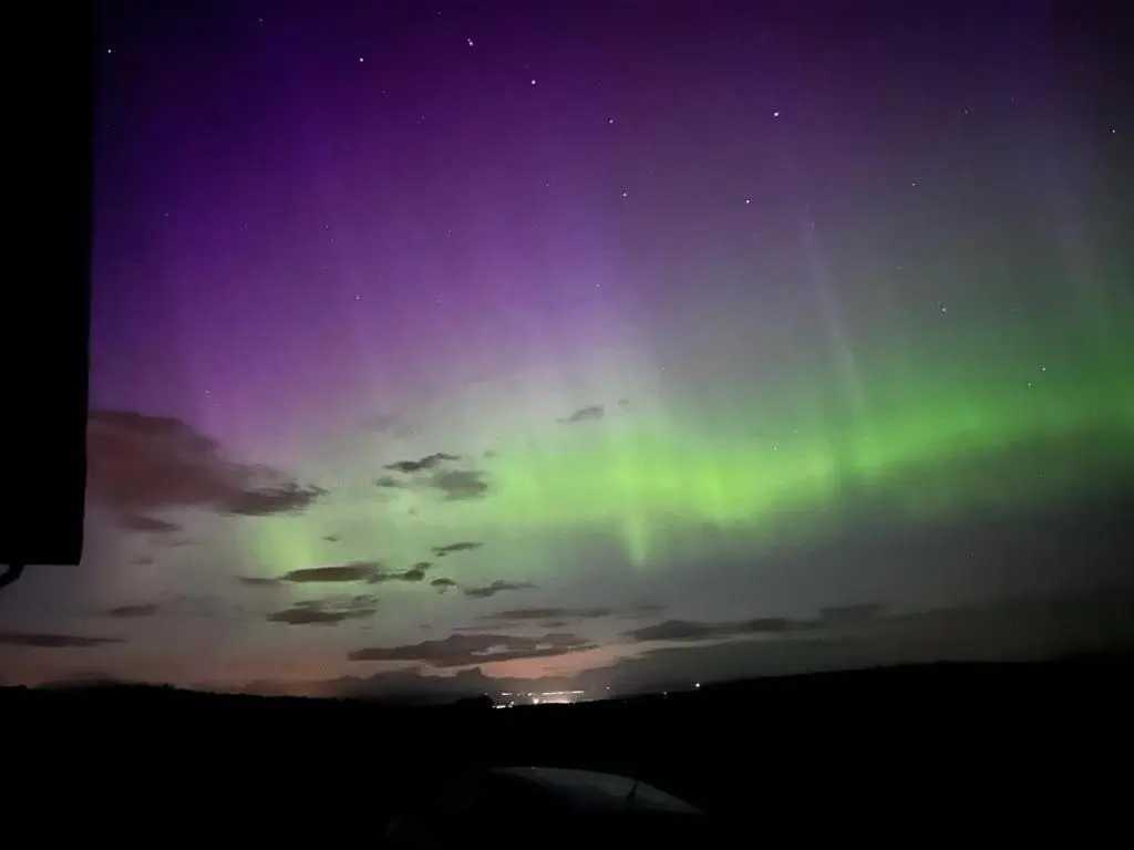 an image of the northern lights in the sky at Primrose Straw Bale Cabin