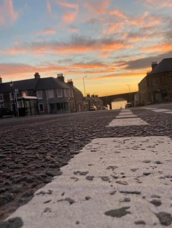 an empty street with snow on the ground at Salt View in Cullen