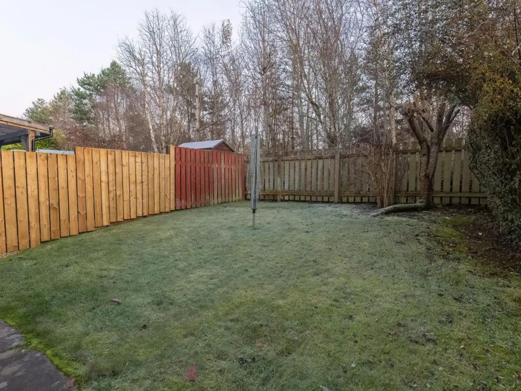 a yard with a fence and a basketball hoop at Villa Cedar House by Interhome in Inverness