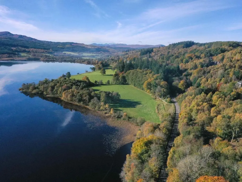 an aerial view of a lake in the fall at Holiday Home Loch View by Interhome in Balnain