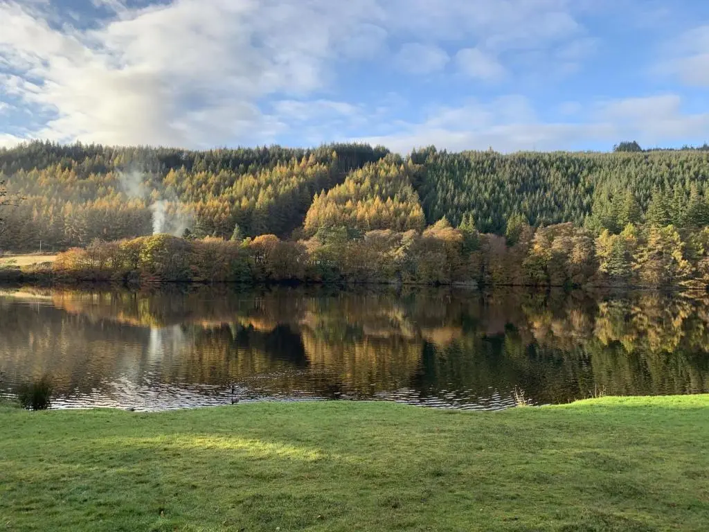 a body of water with trees in the background at Chalet Woodhaven by Interhome in Spean Bridge