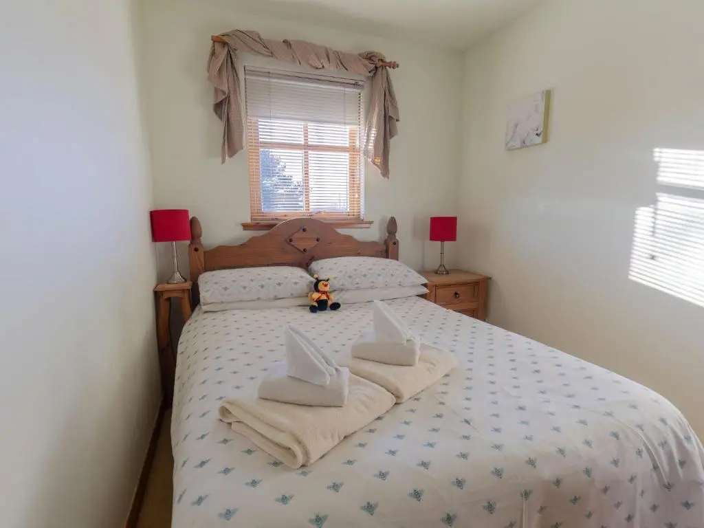 a bedroom with a bed with two pillows on it at Apartment Millar House by Interhome in Inverness