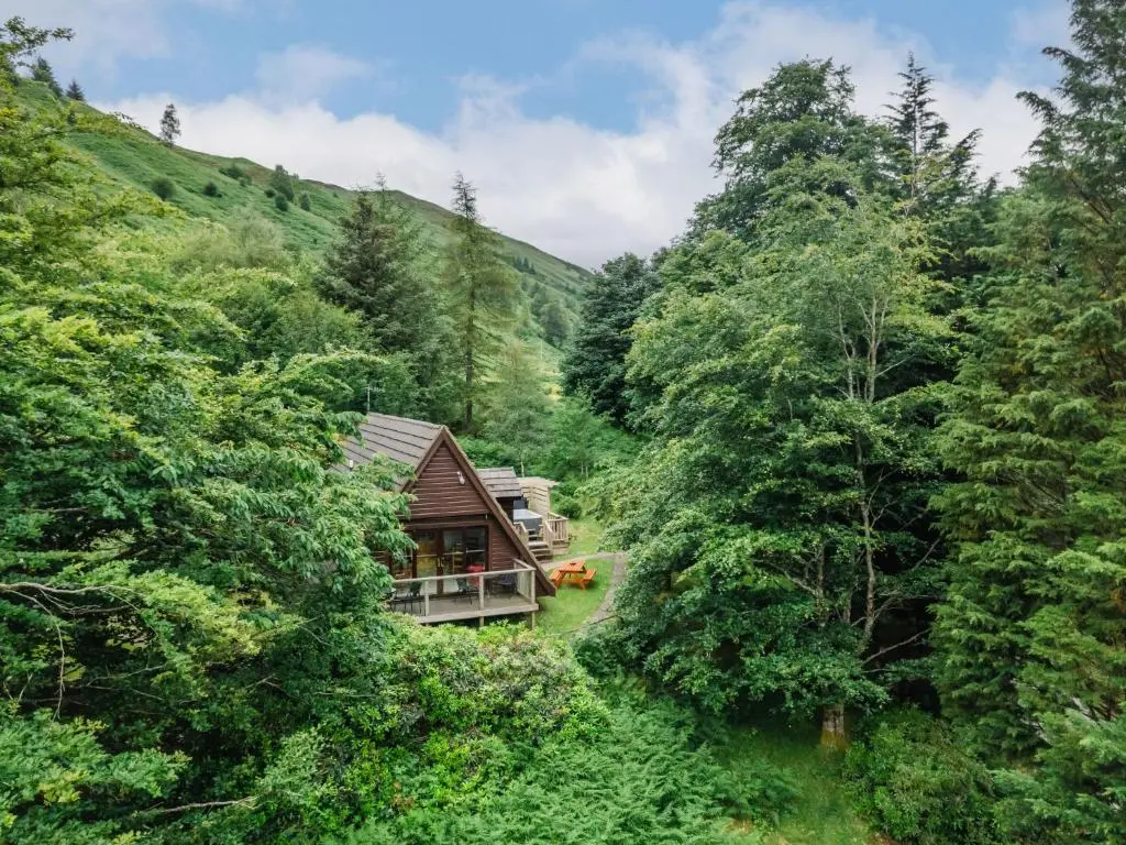 a cabin in the middle of a forest at Chalet Rivendell by Interhome in Spean Bridge