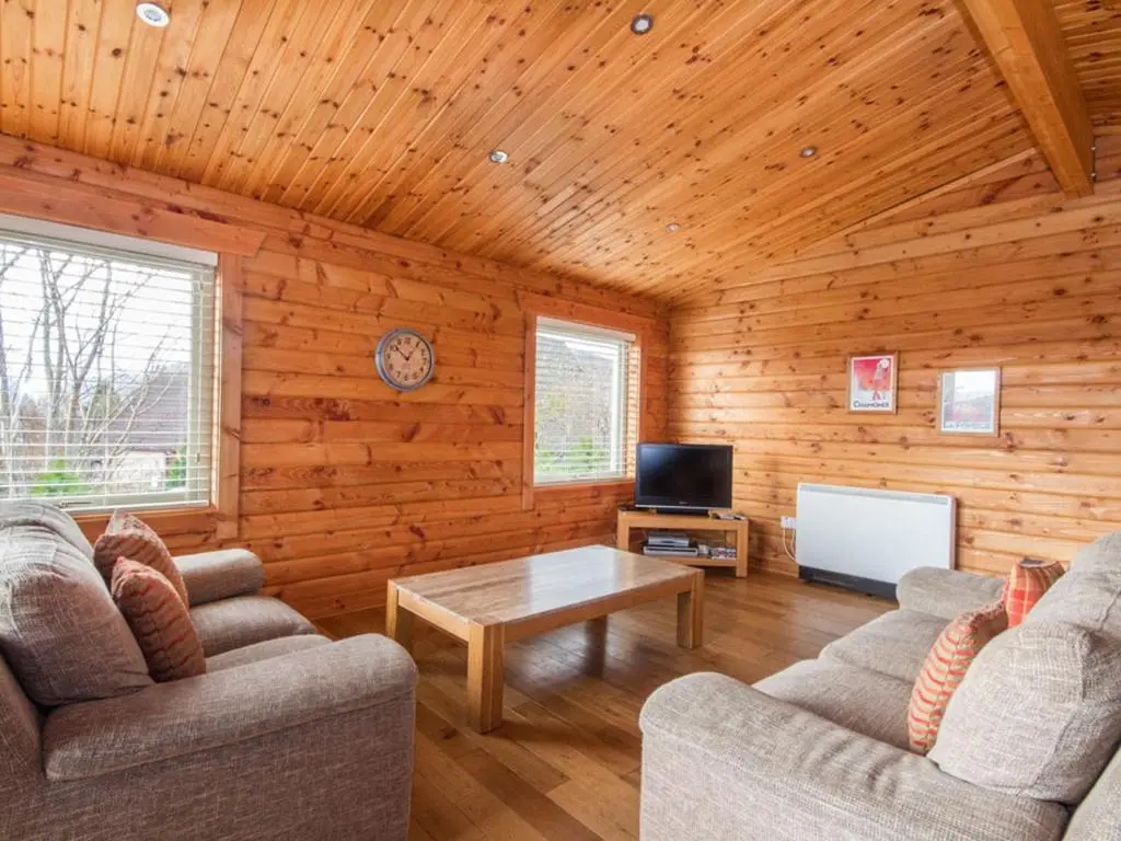 a living room with two couches and a coffee table at Gael Cham in Aviemore