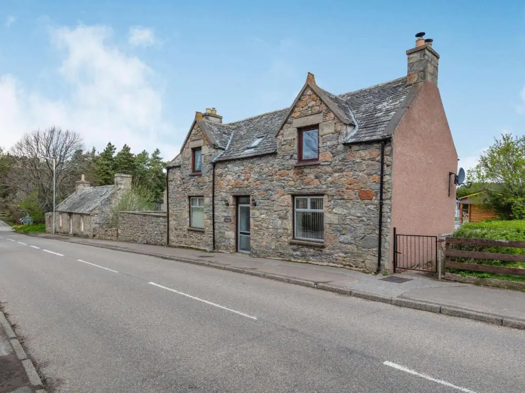 an old stone house on the side of a street at 4 Bed in Tomintoul 46162 in Tomintoul