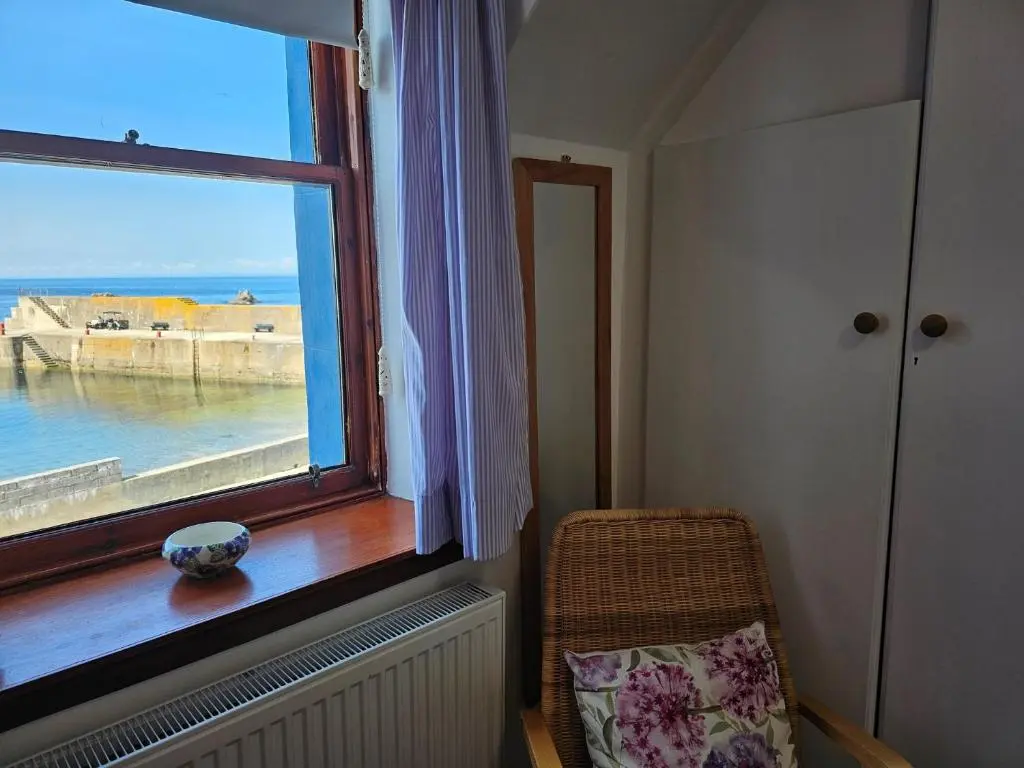 a room with a window with a view of the ocean at 2 Bed in Findochty 76557 in Findochty