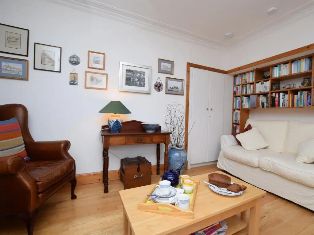a living room with a couch and a table at 2 Bed in Findochty 76557 in Findochty