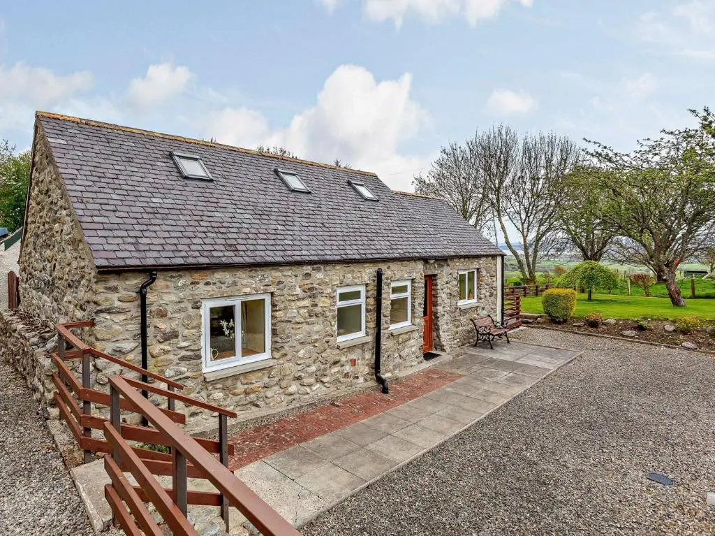 an image of a stone cottage with a porch at 1 Bed in Beauly 82778 in Beauly