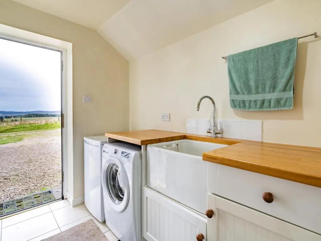a kitchen with a washing machine and a sink at 3 Bed in Carron CA227 in Carron