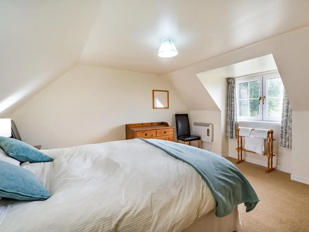 a bedroom with a bed and a window at 3 Bed in Carron CA227 in Carron