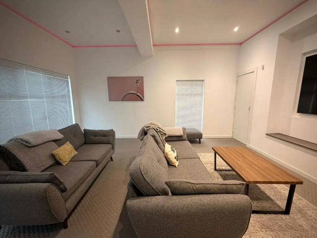 a living room with a couch and a coffee table at BraeView House in Inverness