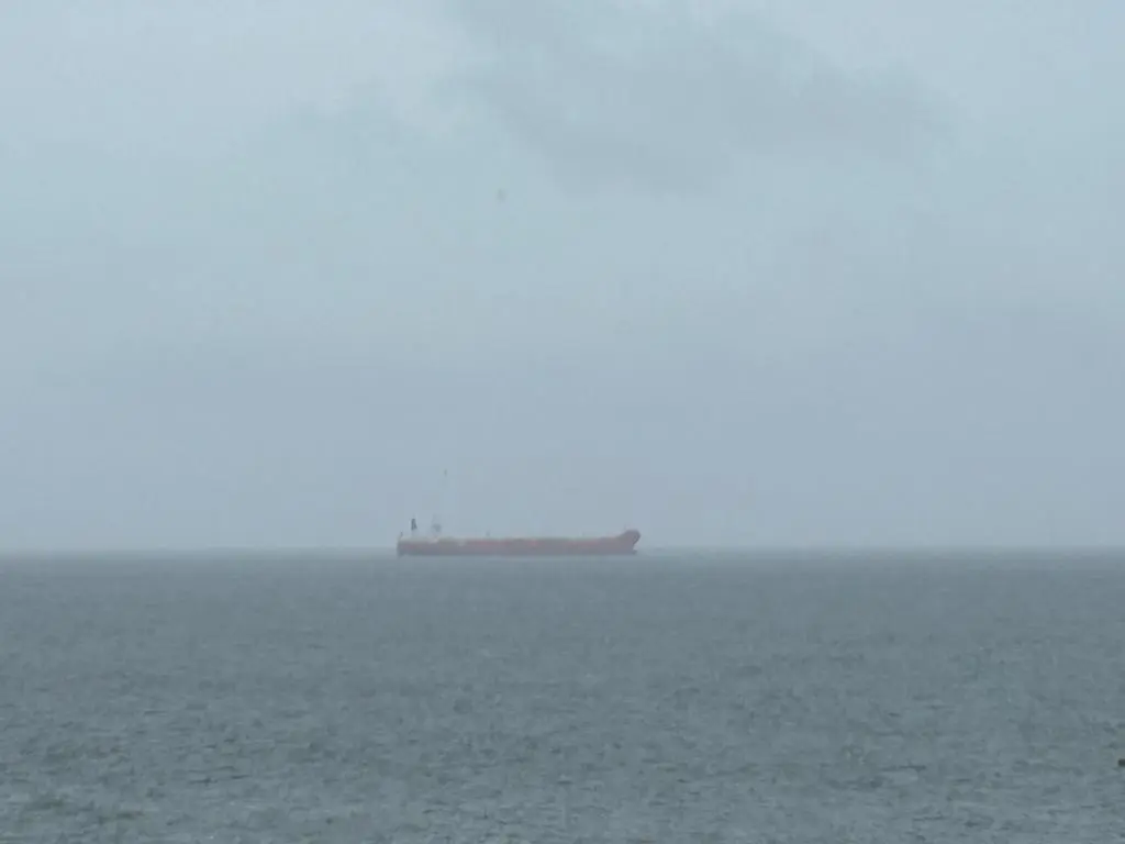 a container ship in the ocean on a foggy day at Buckie Haven 3 Bed Contractors Business Travellers in Buckie