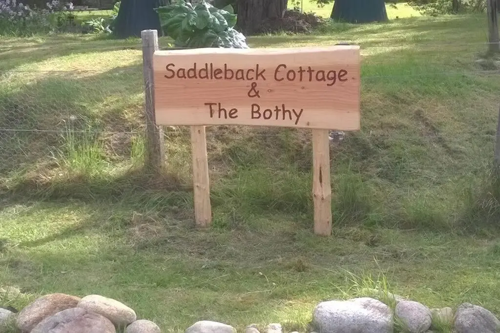 a sign that reads saddleback cottage and the britilty at The Bothy, Nethy Bridge in Nethy Bridge