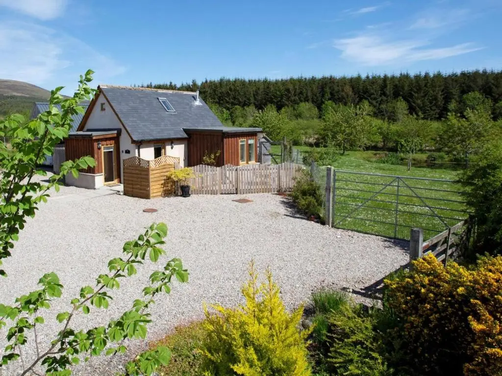 a house with a fence and a gravel yard at 2 Bed in Ardross oc-ca384 in Stittenham